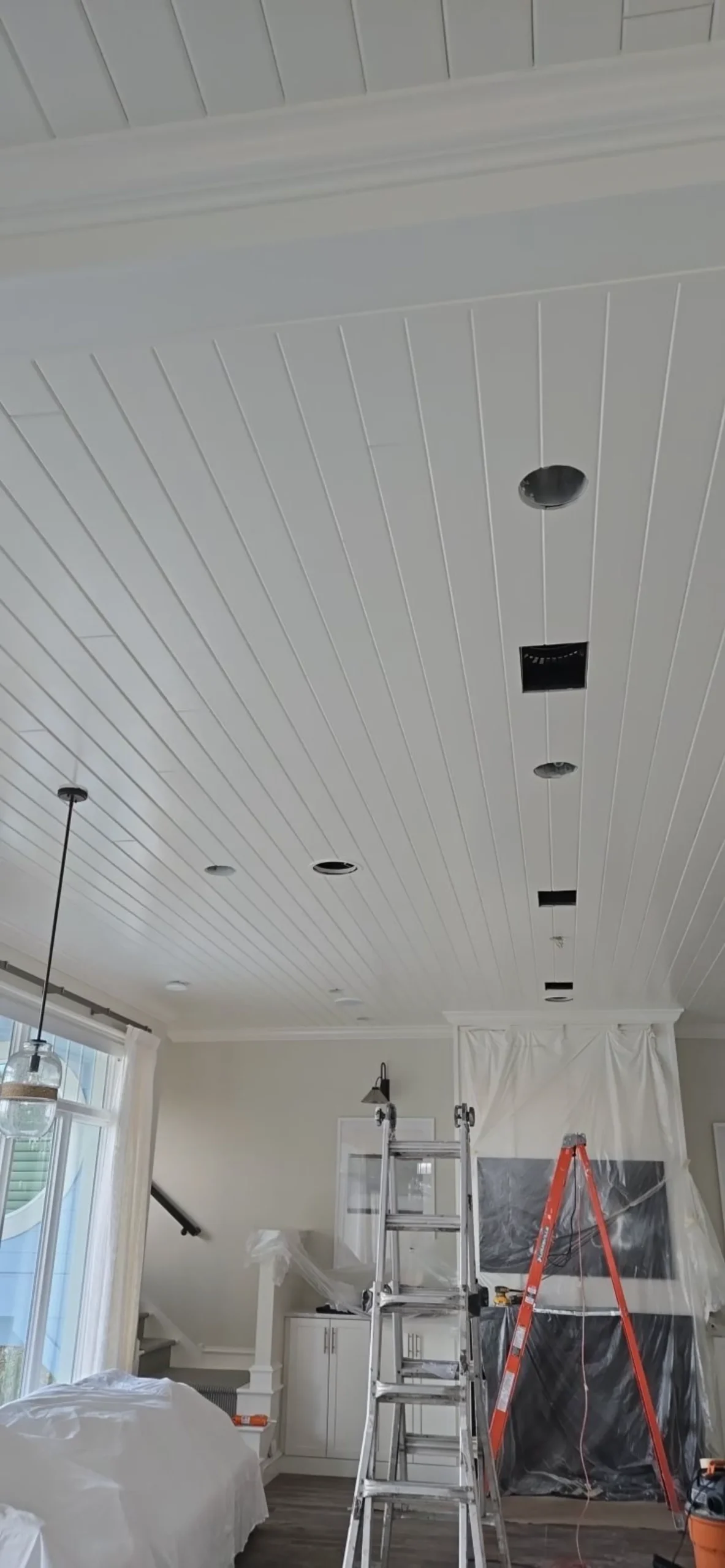 Smooth ceiling with recessed lighting freshly painted