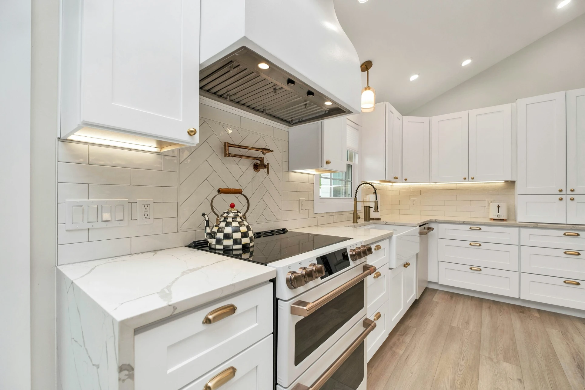 Bright white kitchen with freshly painted cabinets and trim
